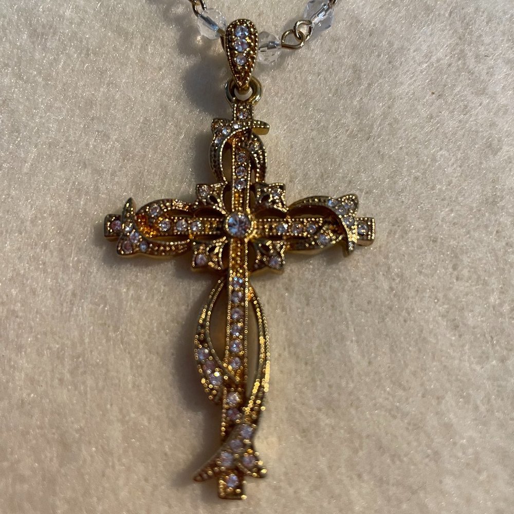Gold tone cross on a beaded chain
